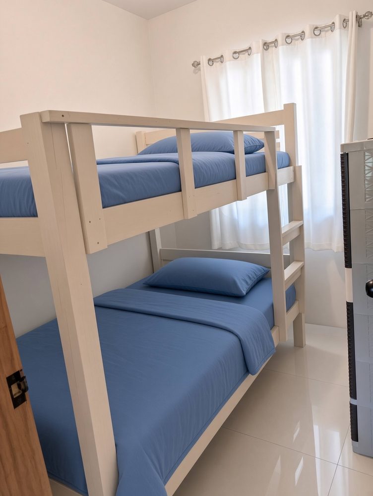 Bedroom 2 with a double-size bunk bed and blue bedding